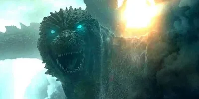 Image d'un monstre géant avec des yeux lumineux et une explosion en arrière-plan.