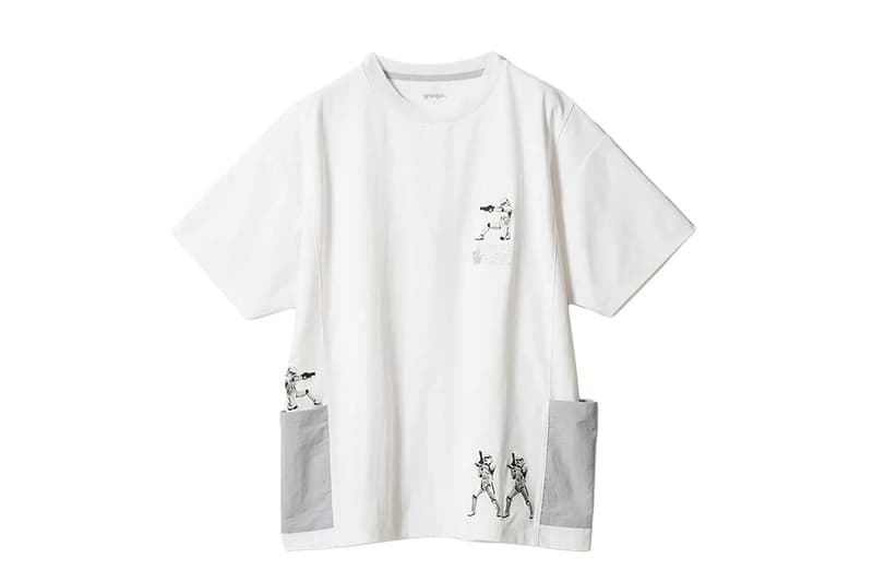 T-shirt blanc avec illustrations de personnages et poches grises