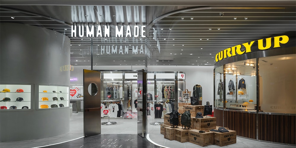 Boutique moderne avec vêtements et accessoires sous des lumières élégantes.