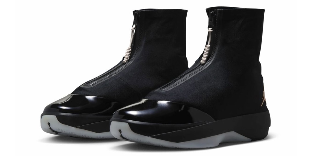 Chaussures noires élégantes avec zip central et bout verni.