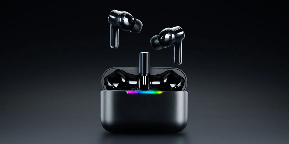 Écouteurs sans fil noirs sortant de leur boîtier avec lumière.