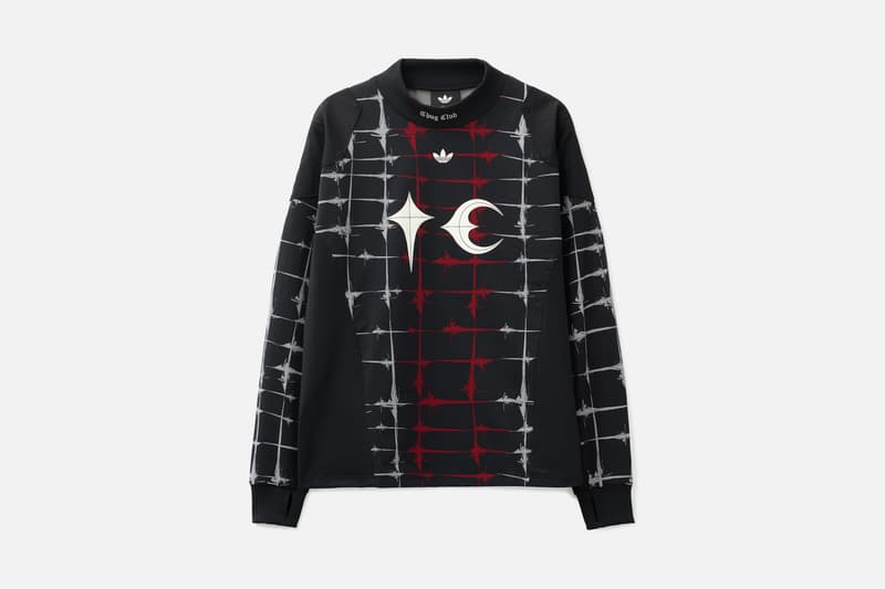 Sweat-shirt noir avec motifs blancs et rouges, design étoile et croissant.
