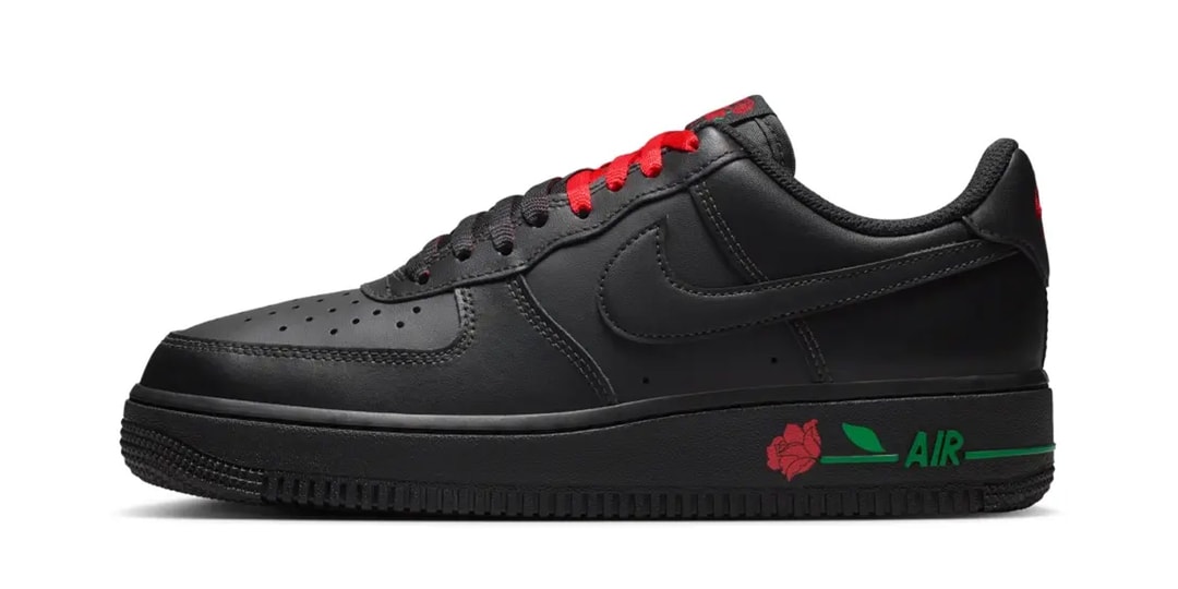 Chaussure noire Nike avec détails rouges et verts, rose sur la semelle
