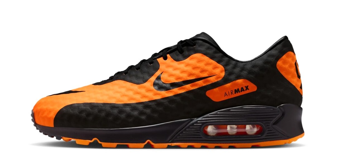 Chaussure noire et orange avec logo Air Max visible