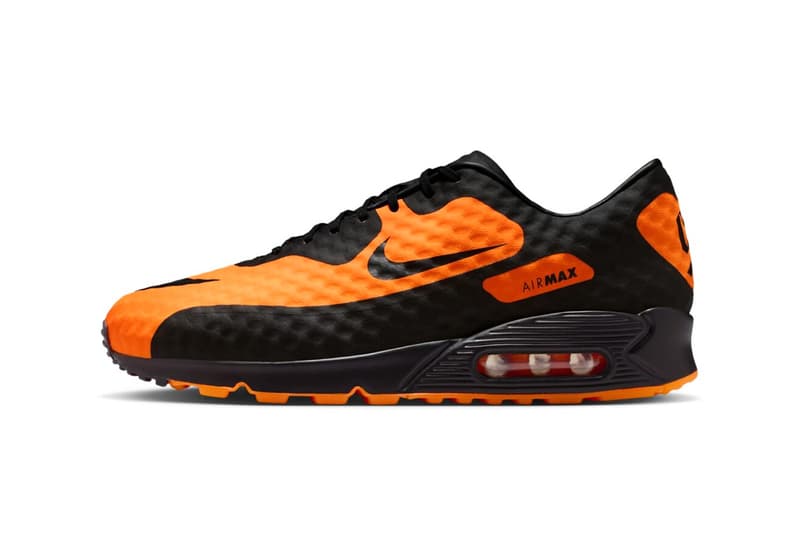Chaussure Nike Air Max noire et orange avec logo visible