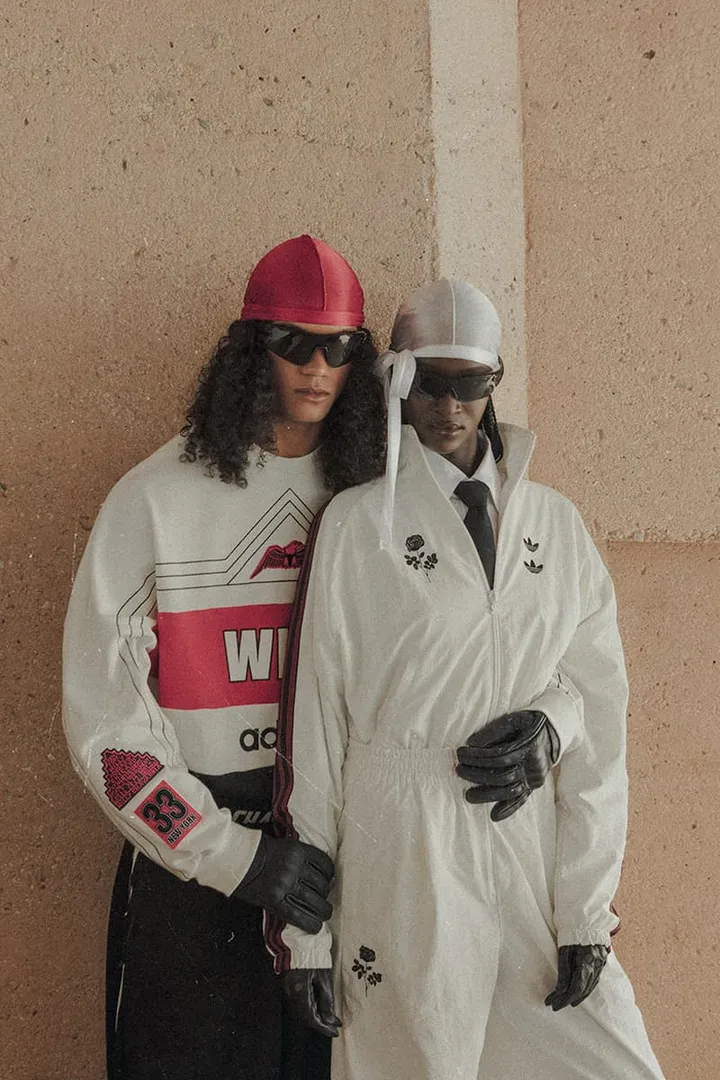 Deux personnes avec lunettes de soleil et vêtements de sport stylés.