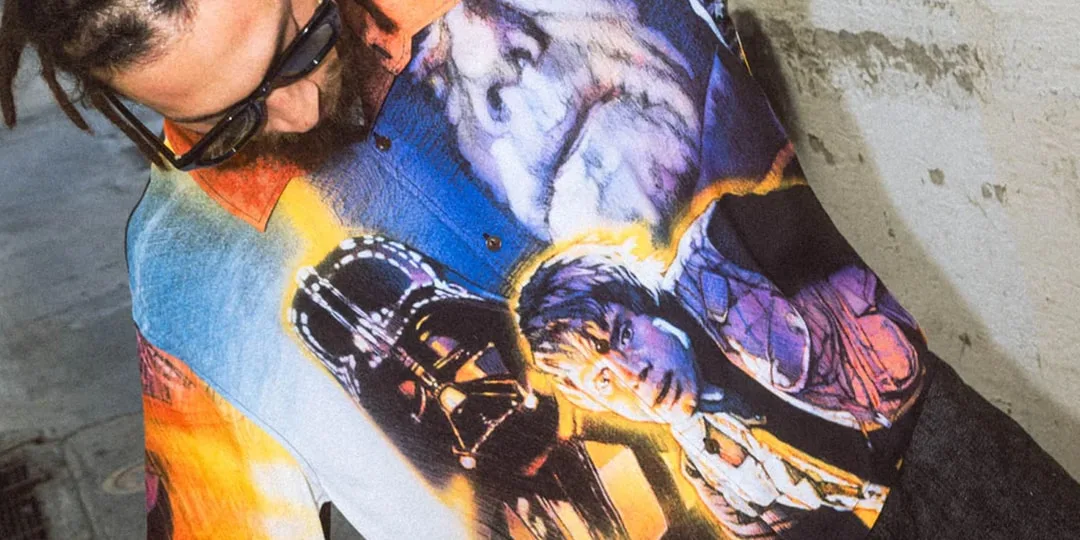 Homme avec chemise graphique de Star Wars, lunettes de soleil noires et dreadlocks