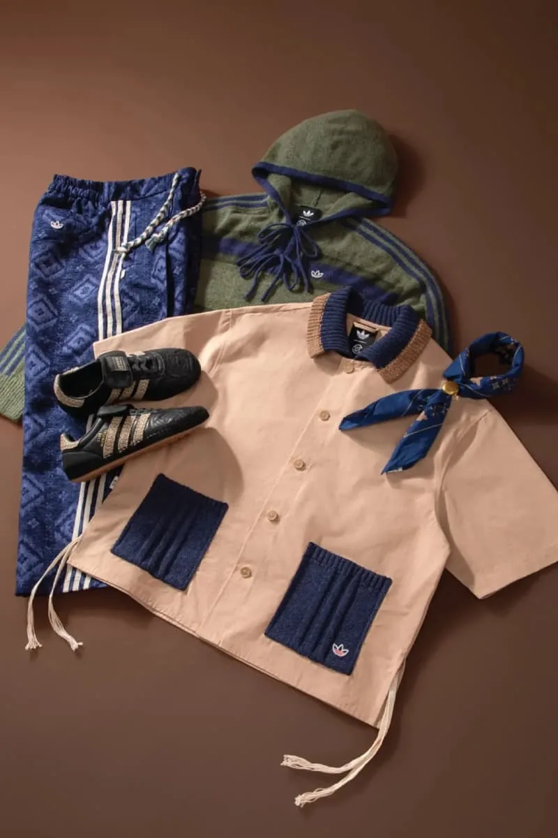 Ensemble de vêtements et chaussures streetwear sur fond marron.