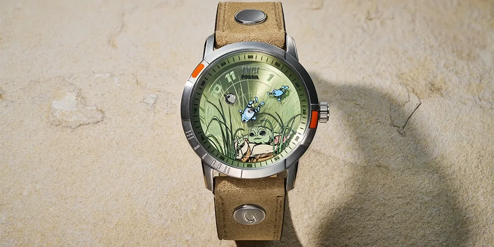 Montre avec motif vert et personnage de style dessin animé.