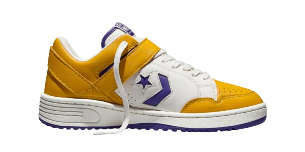 Basket jaune et blanche avec étoile violette sur le côté