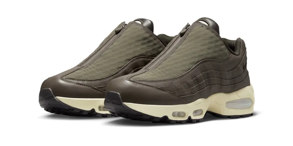 Chaussures de sport marron avec fermeture éclair, semelles crèmes et bulles d'air.