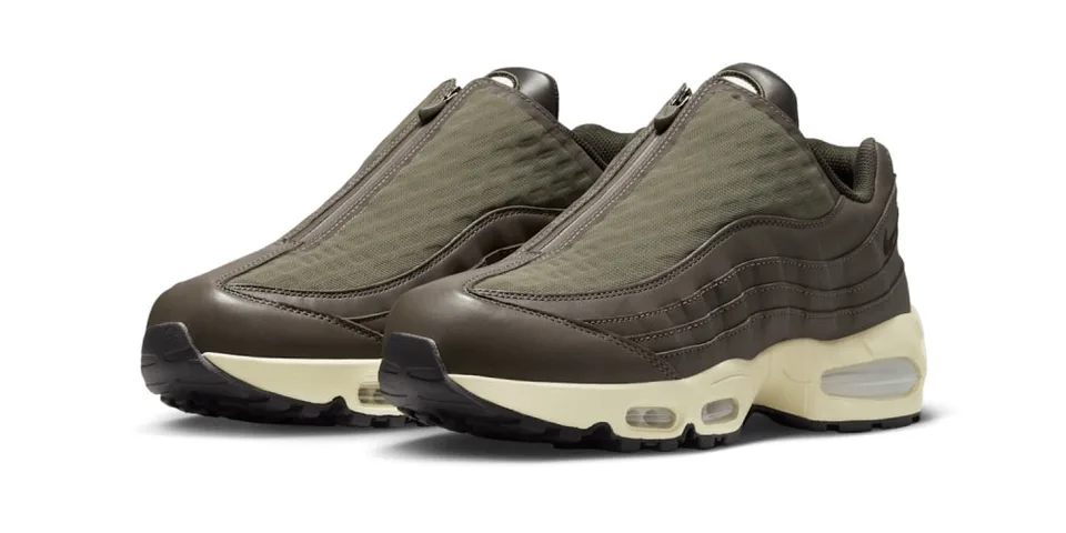 Chaussures de sport marron avec fermeture éclair, semelles crèmes et bulles d'air.