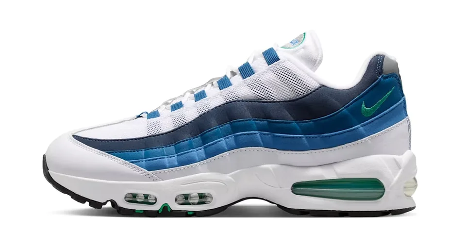 Chaussure de sport blanche et bleue avec logo vert