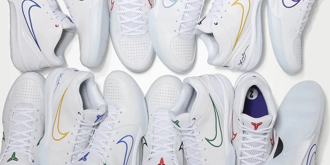Chaussures blanches avec logos colorés Nike sur fond blanc.