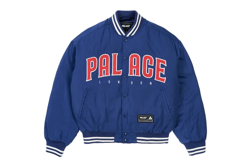 Veste bleue avec 'PALACE LONDON' imprimé en rouge et blanc