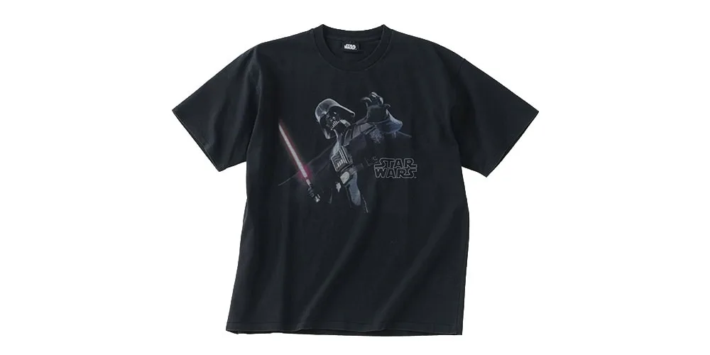 T-shirt noir avec motif Star Wars et personnage emblématique.