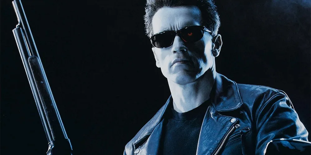 Homme en blouson et lunettes de soleil avec un fusil, ambiance sombre.