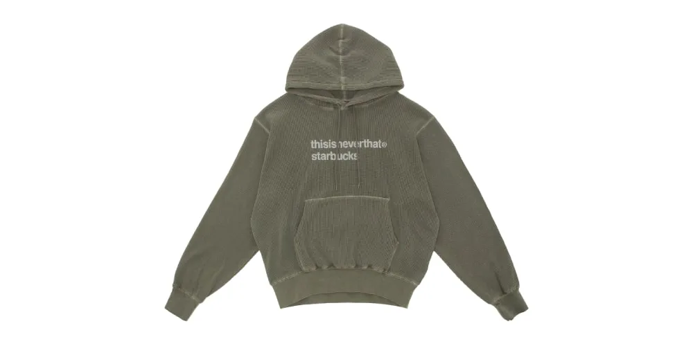 Hoodie vert avec texte 'thisisneverthat starbuck' sur le devant.