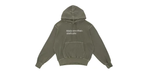 Hoodie vert avec texte 'thisisneverthat starbuck' sur le devant.